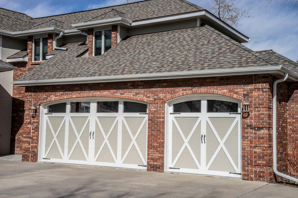 roofing bella vista ar-red brick house with gray shingled roof