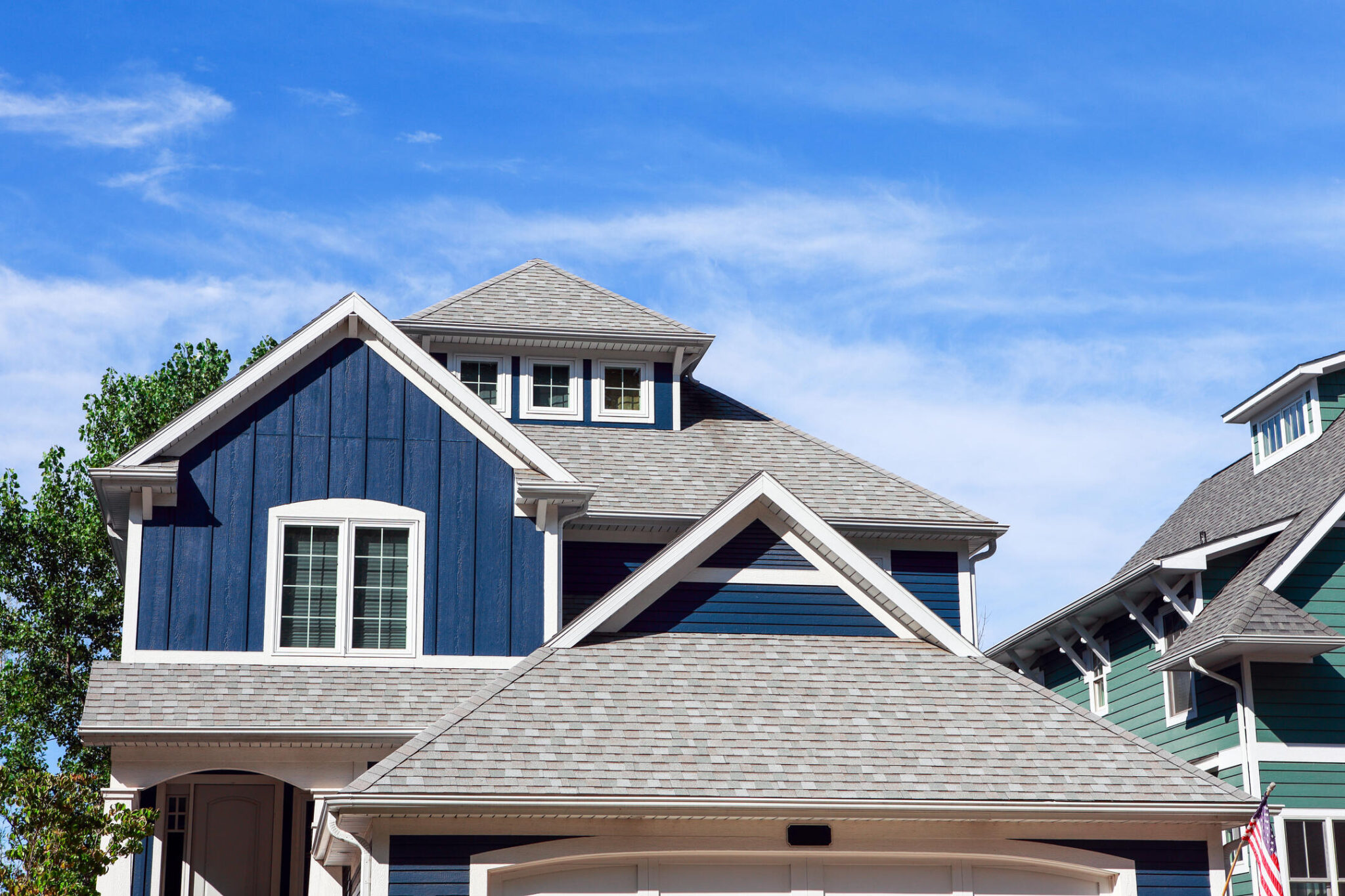 roofing bentonville ar-blue sided house with gray shingled roof