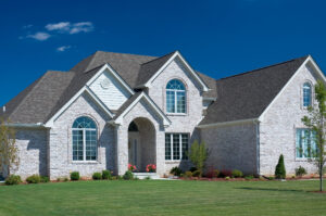 Luxurious raytown missouri home with greenery, garage, and driveway.