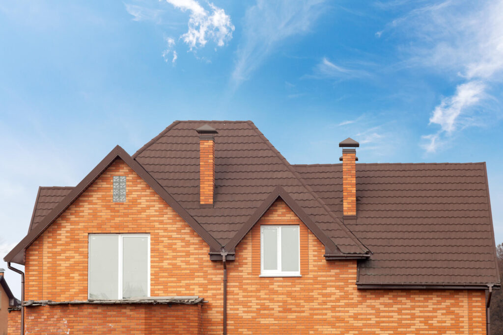 stone coated roofing-brick house with brown stone coated metal roof