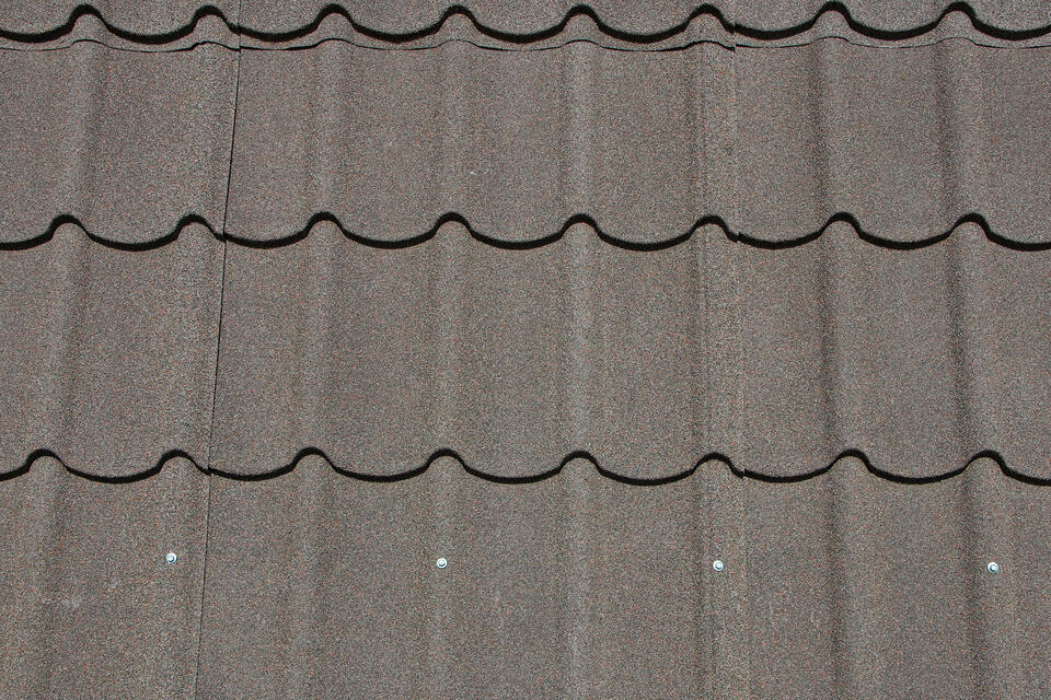 stone coated roofing-close up of gray stone coated metal roof