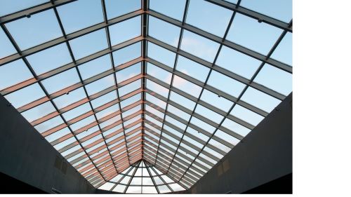 Modern glass roof skylight for commercial roofing and construction projects.