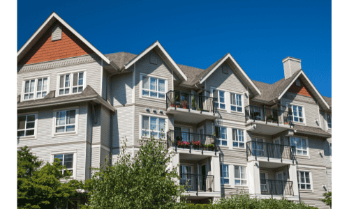 Modern multifamily apartment building with durable roofing and siding.