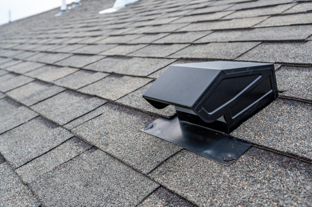 types of roof vents-close up of a box vent on a shingle roof