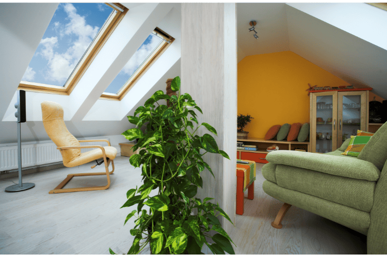 Skylight living room with roof windows and modern cozy furniture for home comfort and natural light.