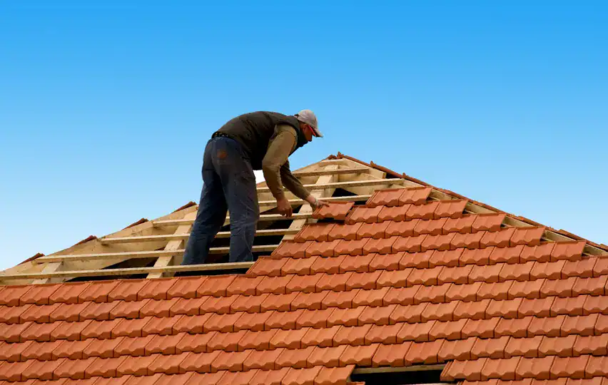 Shamrock-roofing-and-construction-worker-installing-tile-roof.