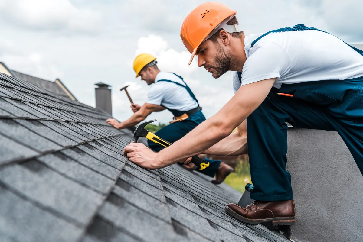 roofers working on roof 