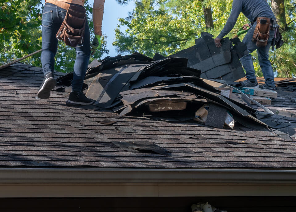 does homeowners insurance cover roof replacement-roof crew removing old roofing materials