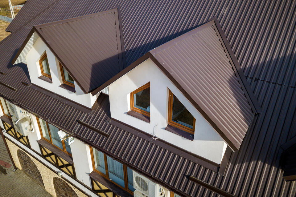 metal roofing types-overhead view of a home with brown corrugated metal roofing