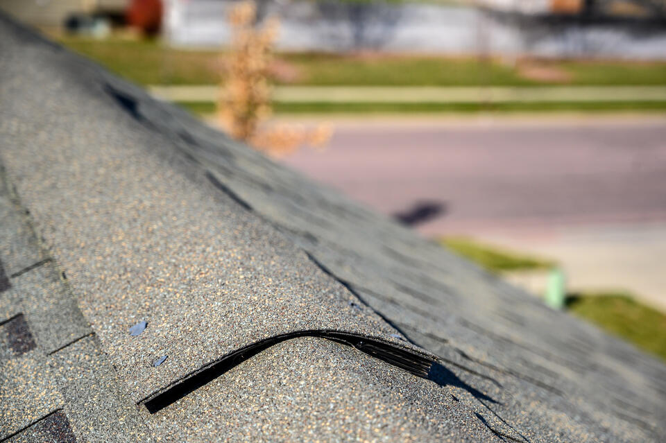 roof ridge cap-close up view of a shingled roof with ridge cap shingles