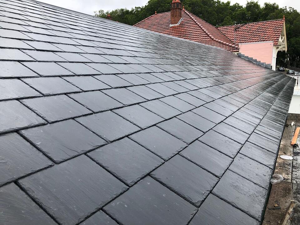 rubber slate roof-synthetic black slate roofing on a house