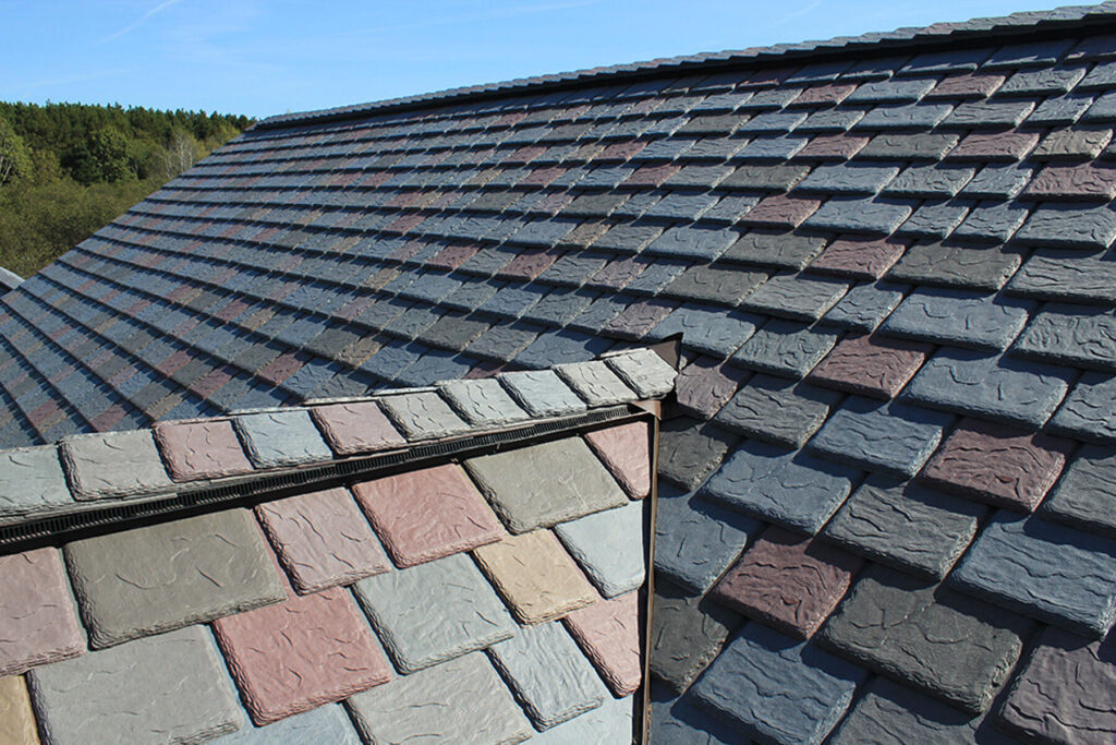 rubber slate roofing-multicolored synthetic slate roofing on a house