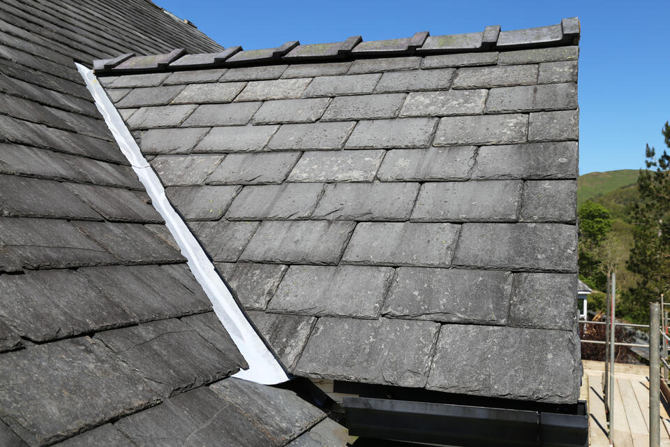 best roofing shingles-gray slate shingles on a house roof