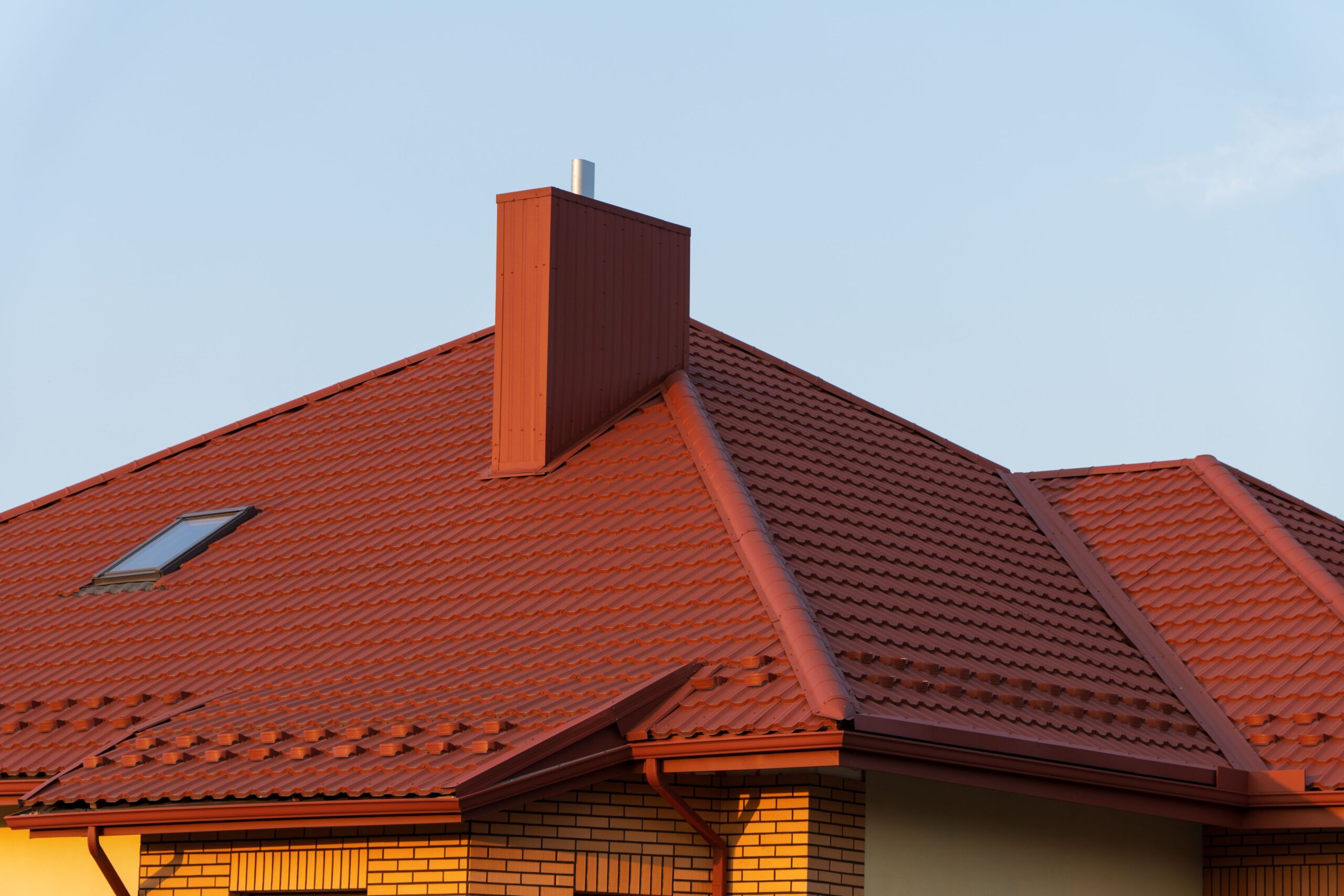 Roofer Fayetteville Arkansas inspecting a residential roof for damage
