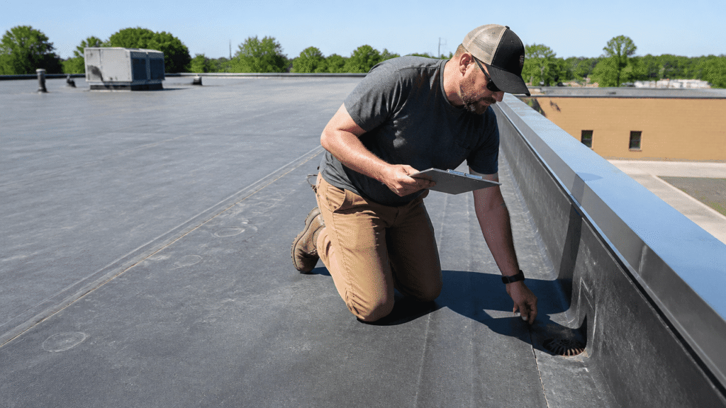 EPDM flat roof on a commercial building showing durable summer weather protection and maintenance control