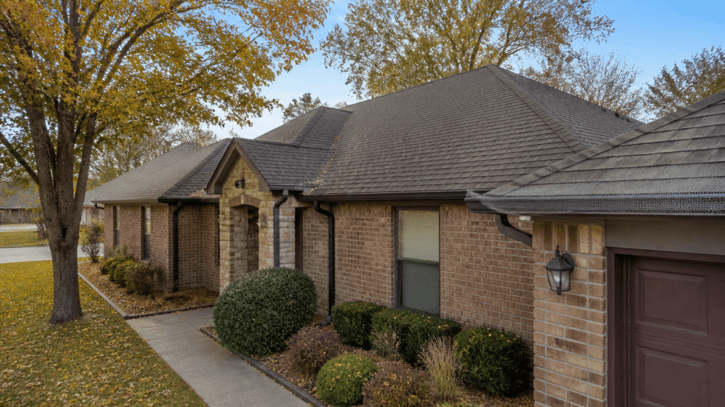 Best gutter guards on a suburban home in Sherman, TX during fall with clean protected gutters